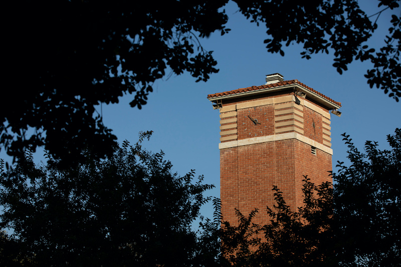 Sunset view of the historic clock tower of the downtown skyline of La Verne, California, USA.