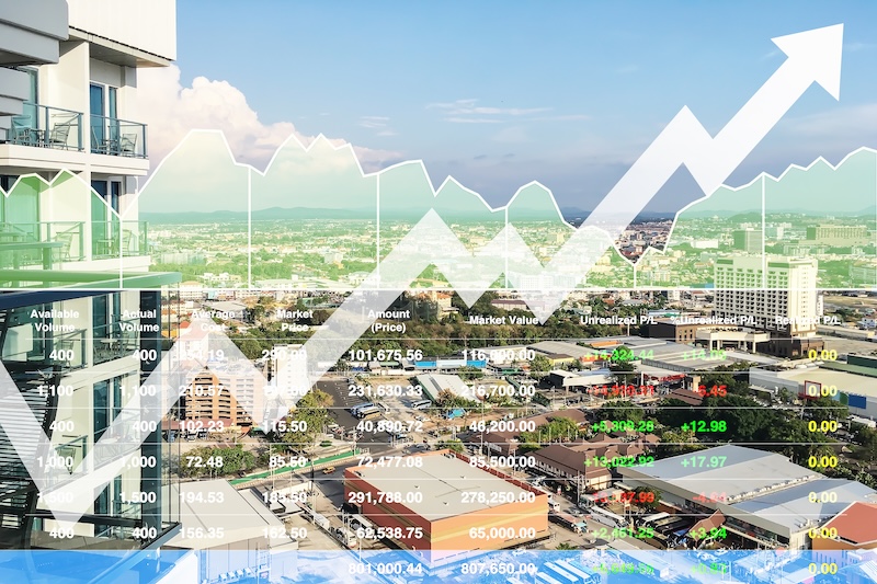 Stock financial index of successful investment on property real estate business and construction industry with graph and chart on city background.