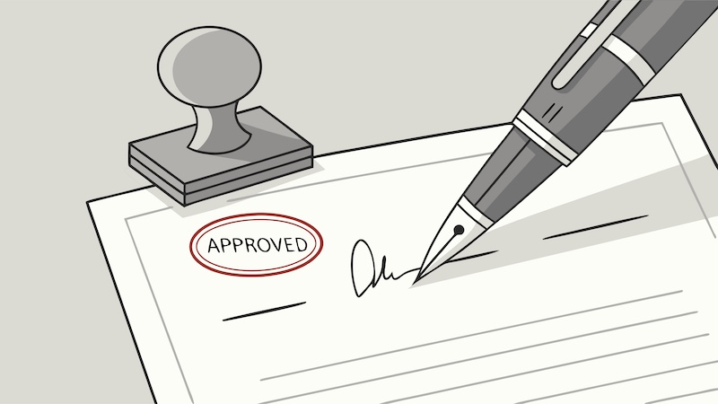 Approved Document with Signature and Stamp Under a Pen on Gray Background