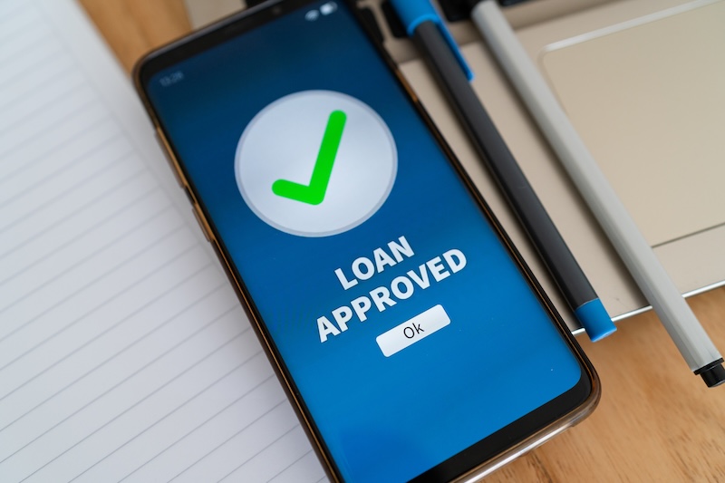 Loan approval notification on smartphone banking app. Concept of credit approved.